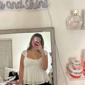 White flowy top
